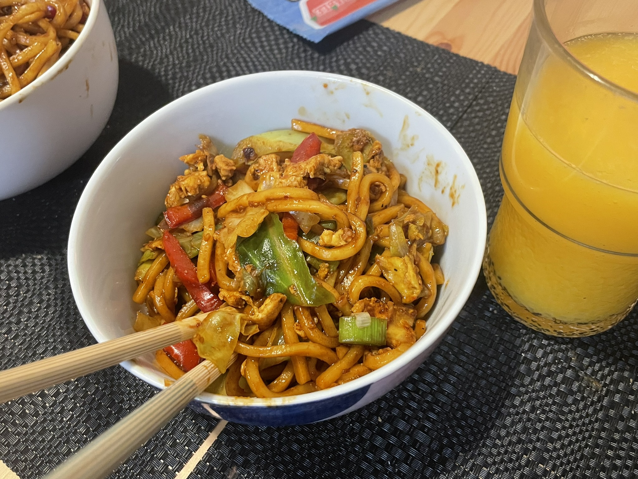 yummy warm yellow hokkien noodles dish with veggies and tofu